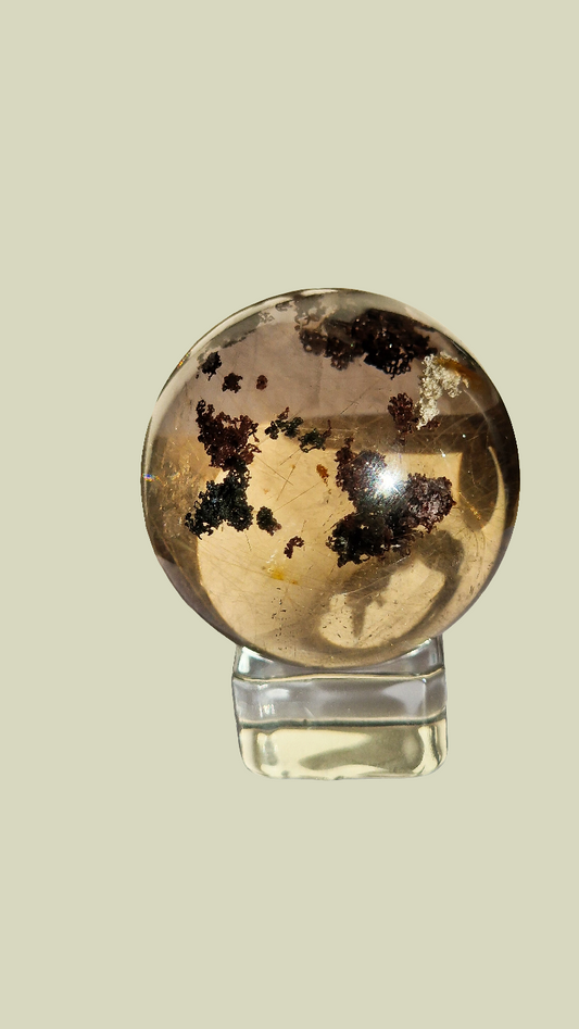 Lodolite and fine golden rutile sphere